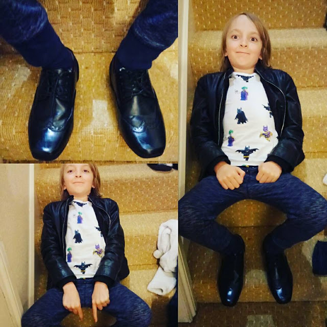 George smart. 3 photos, one of George's smart shoes and two of George posing on a set of stairs.
