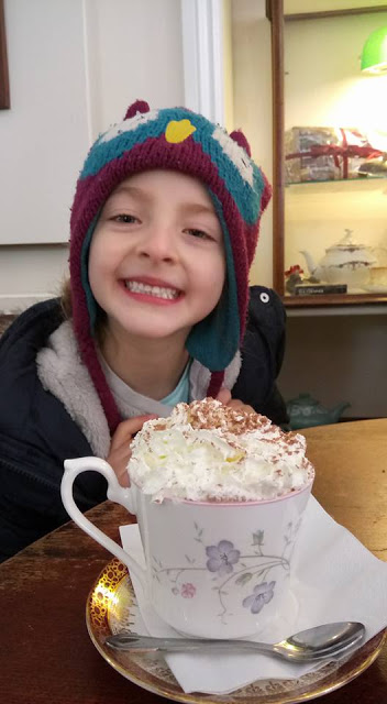 Molly. Molly wearing a woolen hat and smiling.